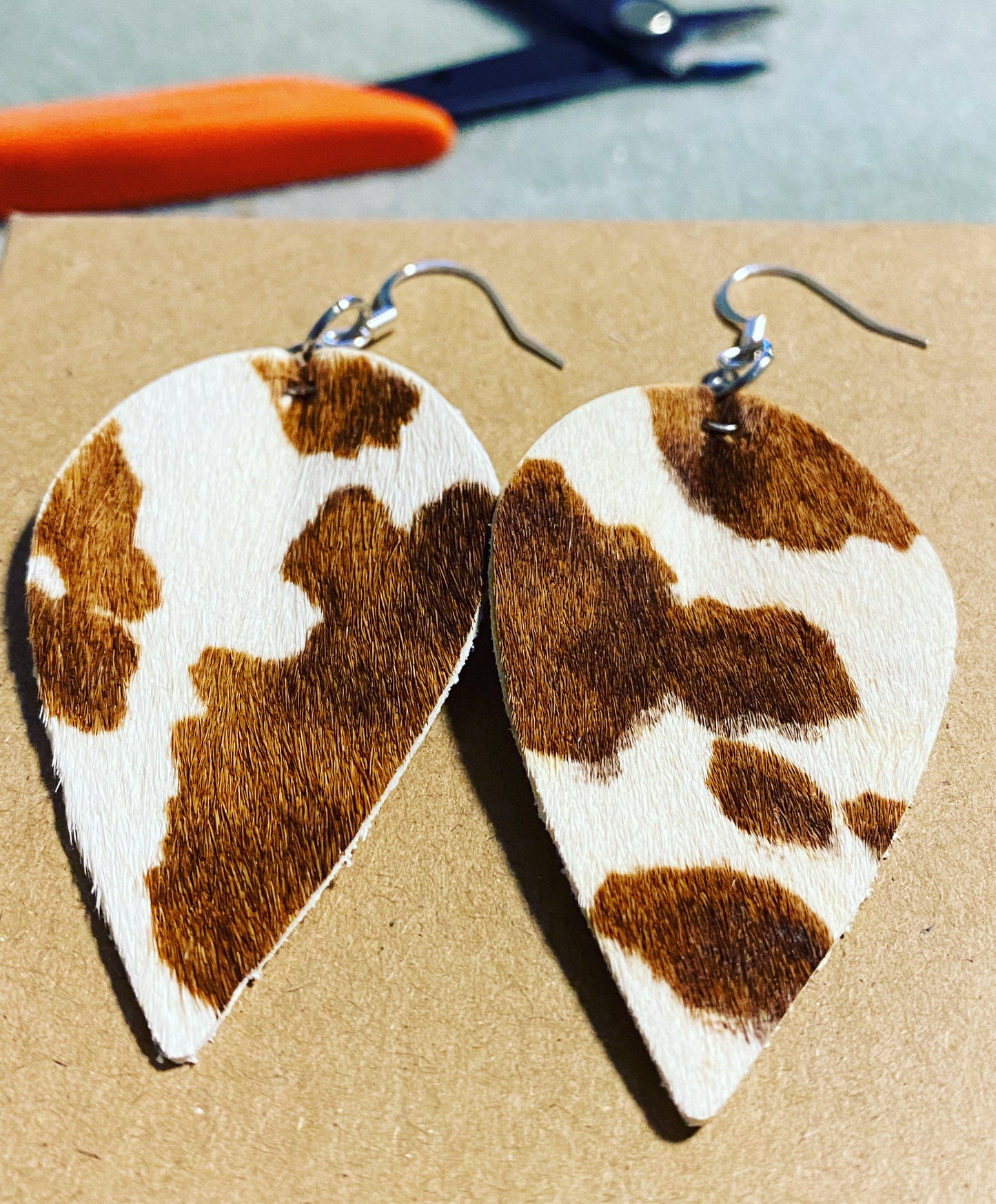 Leather cow vibe earrings